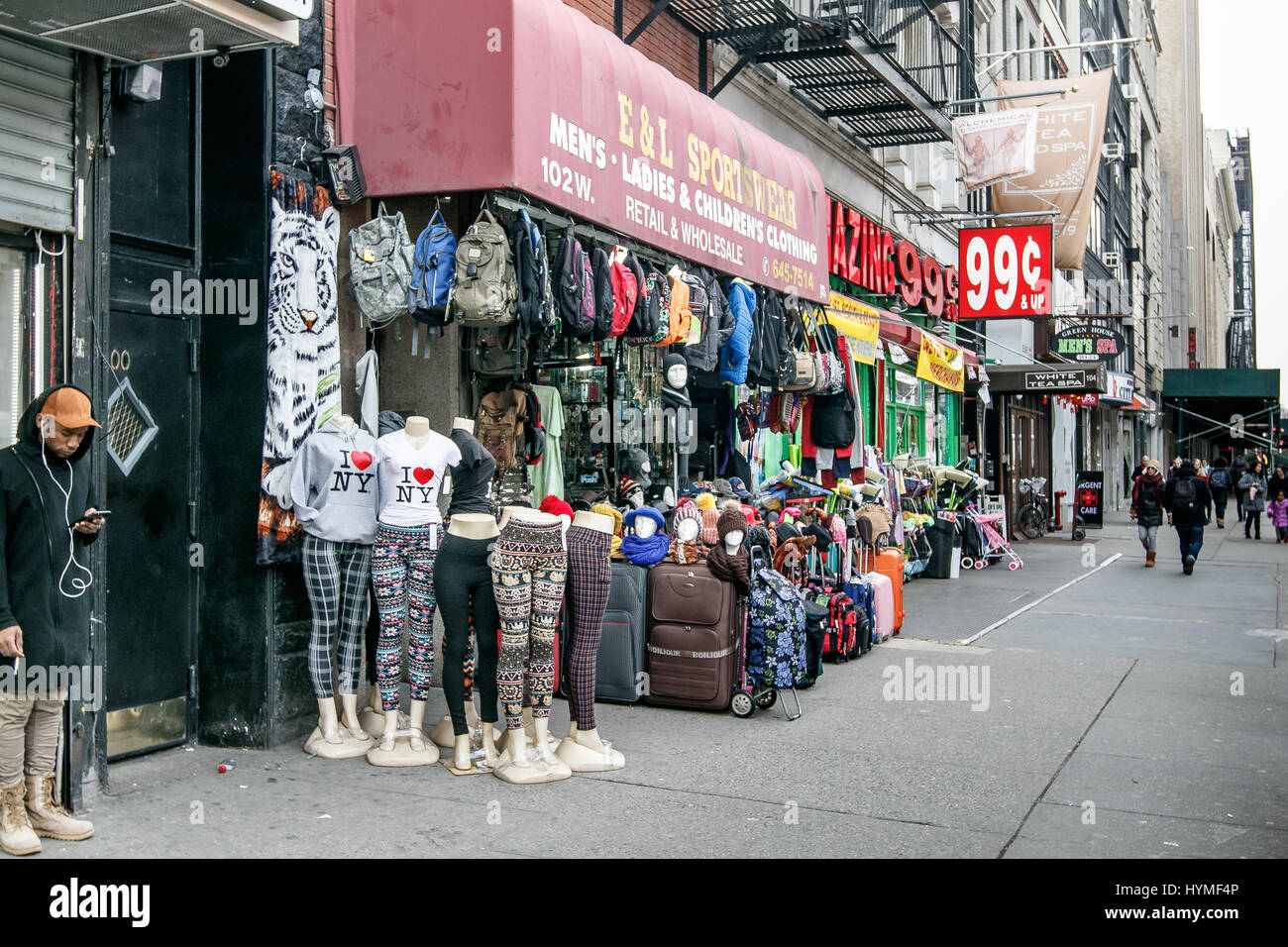 Merchandise of a small store on 14th street in Manhattan is set up on