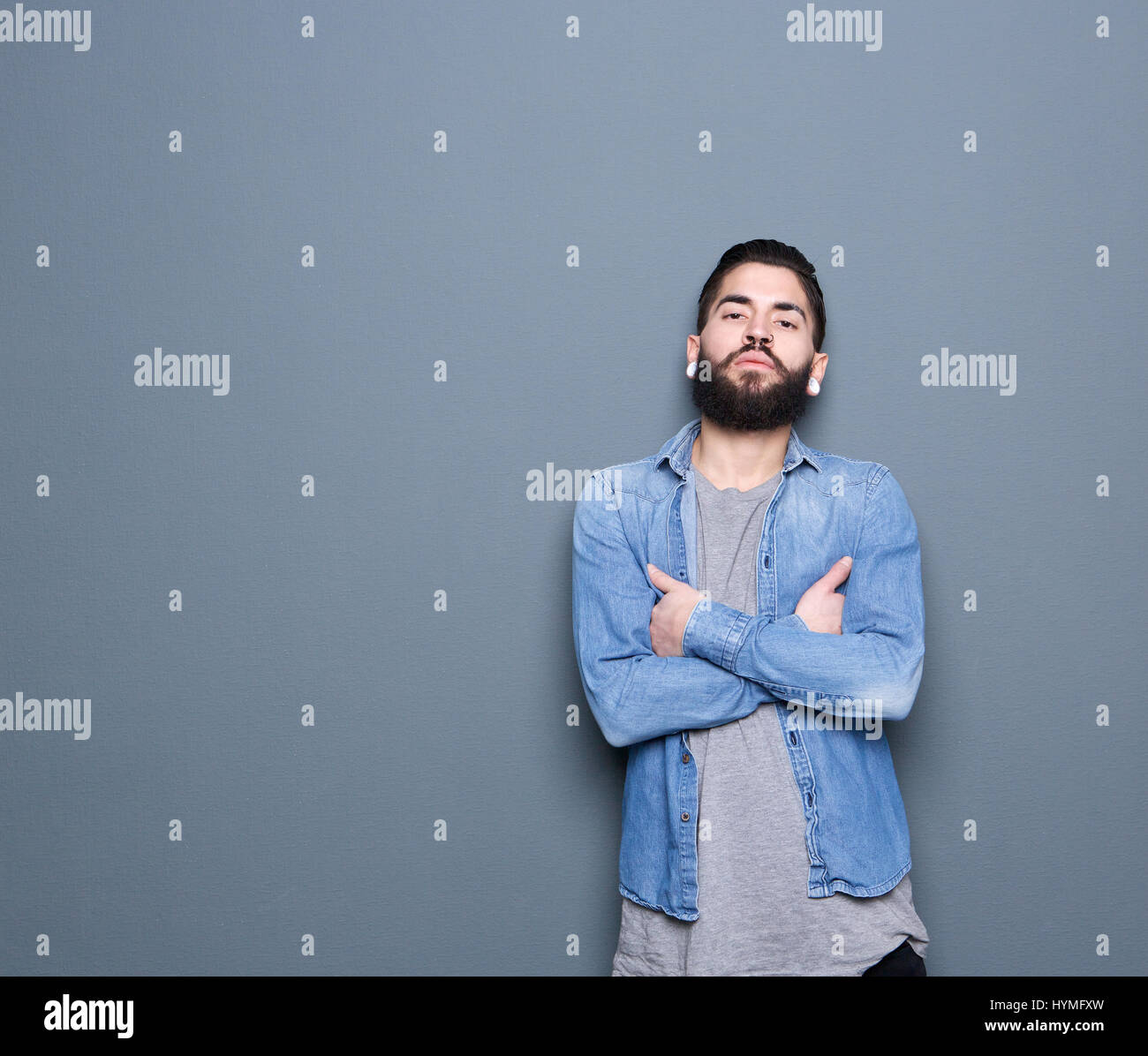 Cute guy posing crossed arms hi-res stock photography and images - Alamy