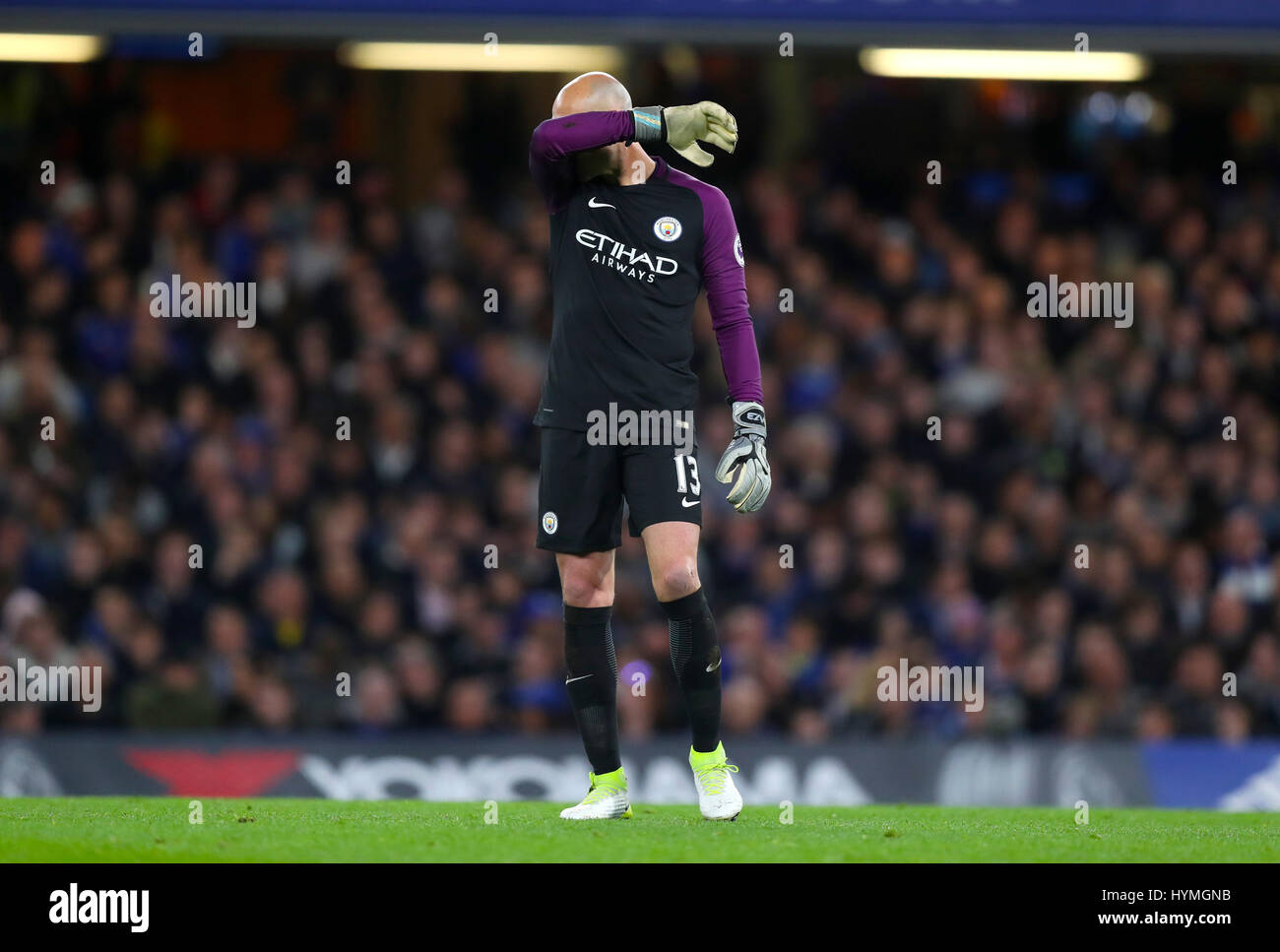 Manchester City goalkeeper Willy Caballero looks dejected during the Premier League match at Stamford Bridge, London. Stock Photo