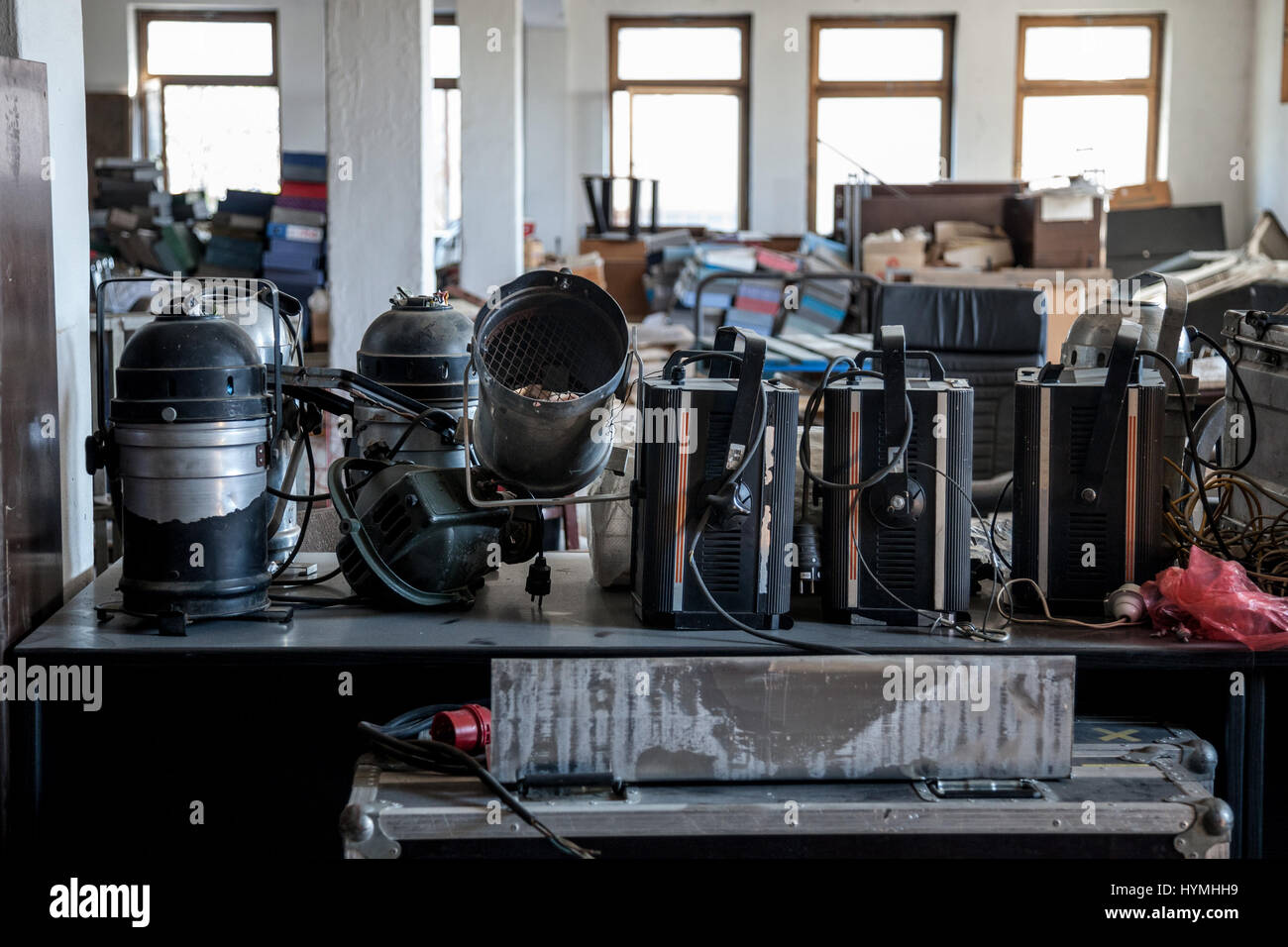 Damaged stage spotlights in an abandoned theater  Old and used theatre spotlight projectors laying in an abandoned theatre Stock Photo