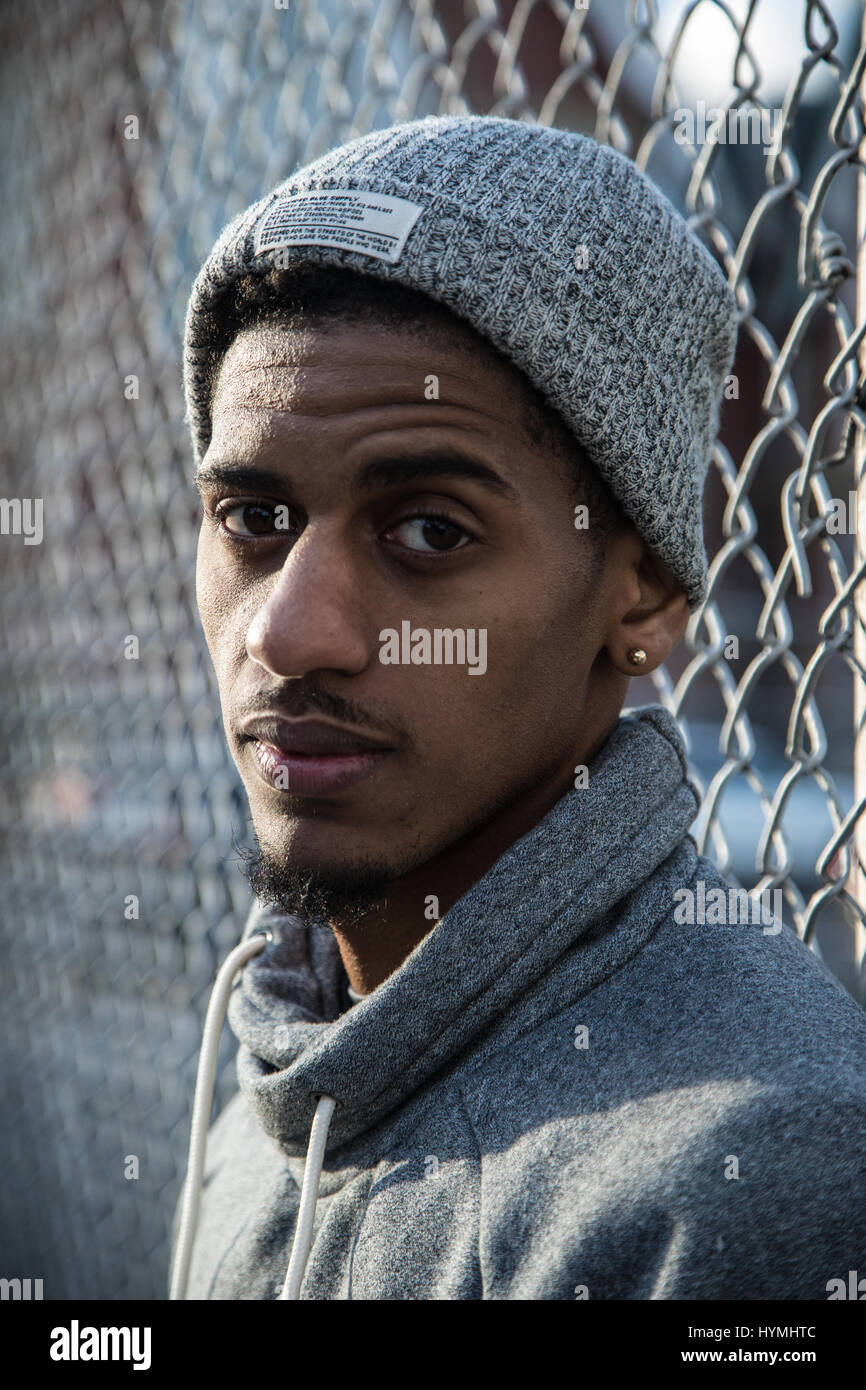 A closeup portrait of a young, black man in New York City. Shot during ...