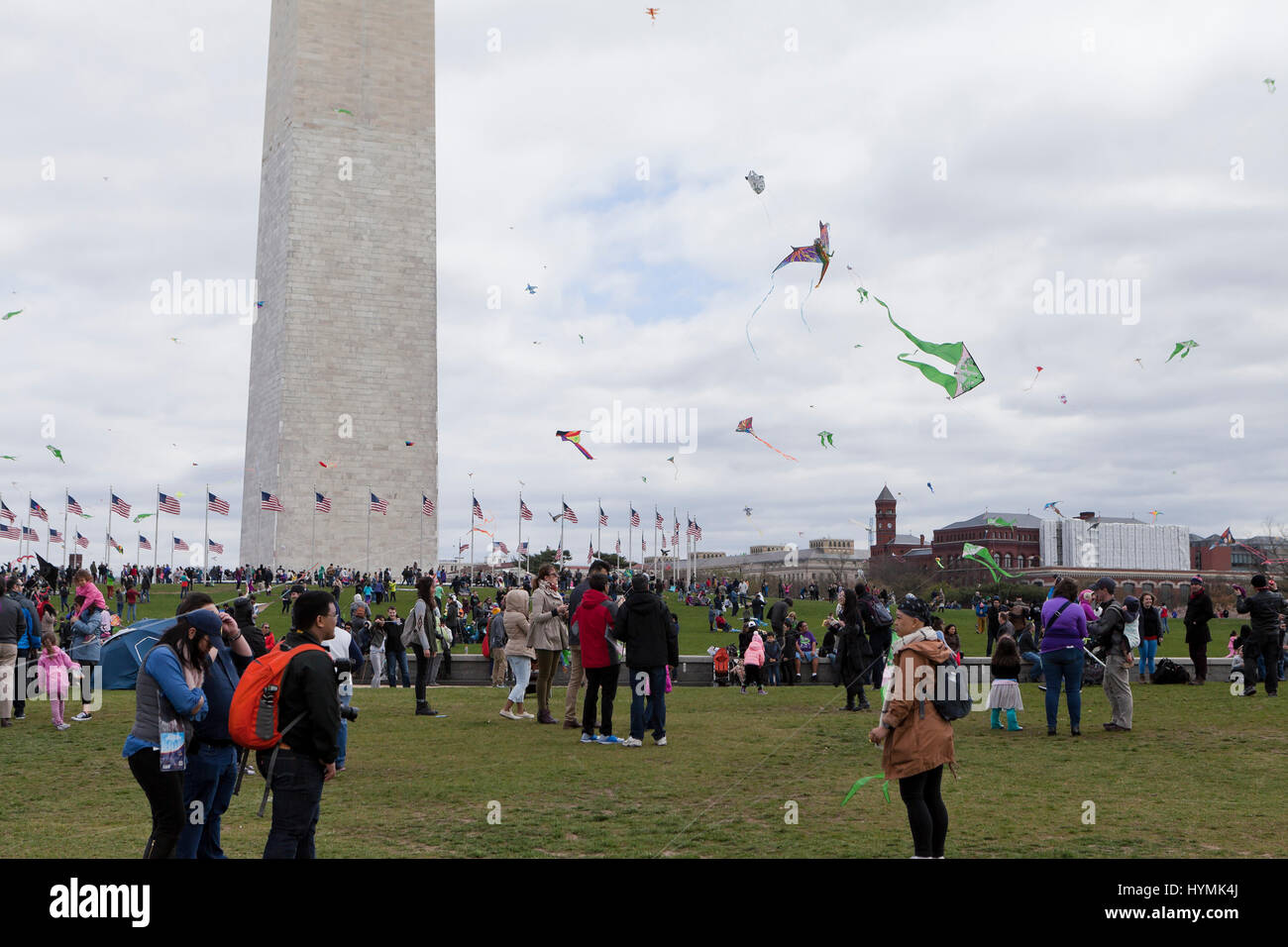 People flying kites on the National Mall during 2017 National Kite festival - Washington, DC USA Stock Photo