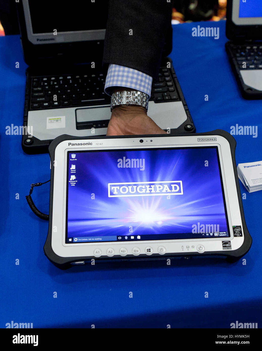 Man holding Panasonic Toughpad (rugged tablet PC) - USA Stock Photo