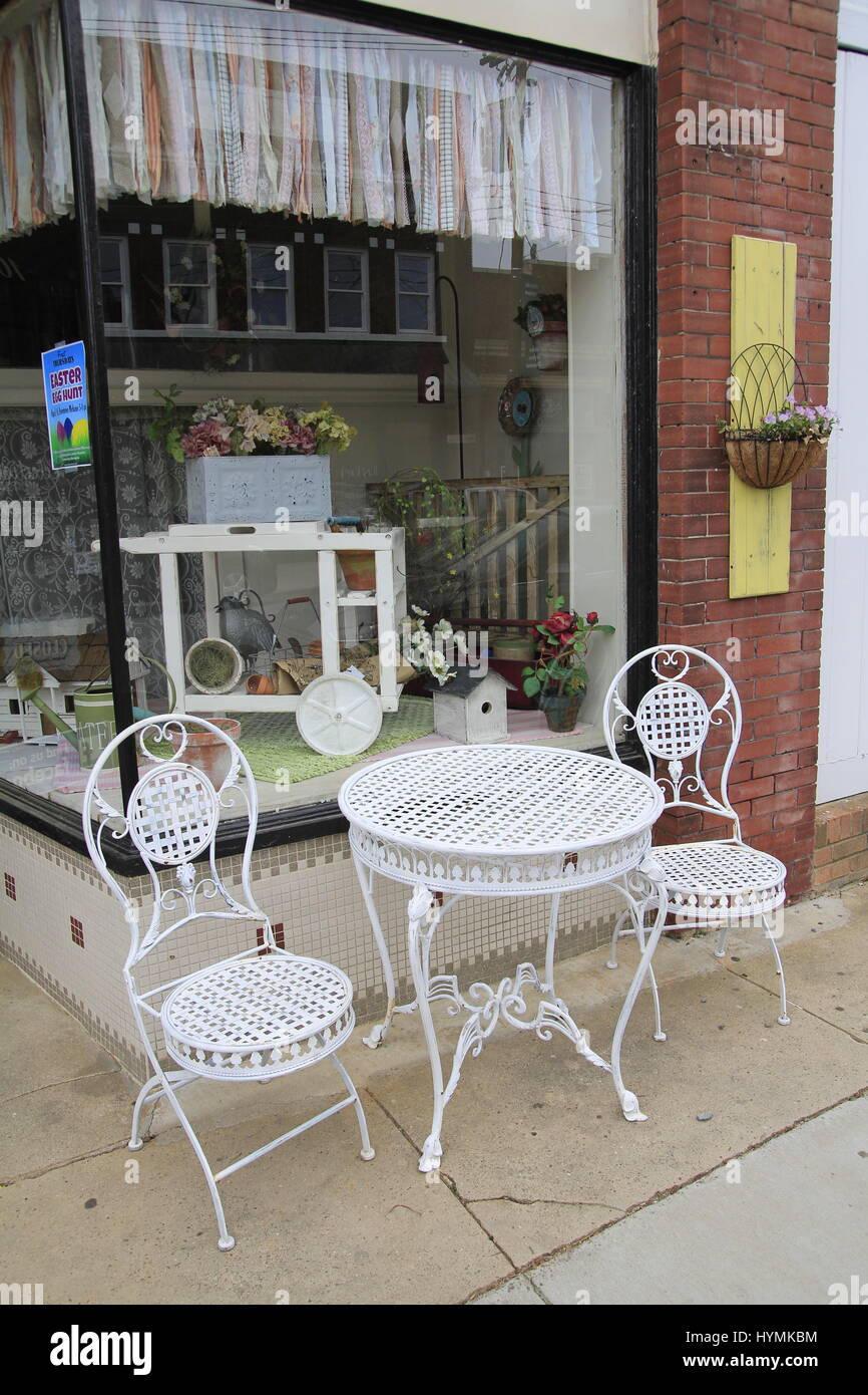 Patio furniture on street in front of consignment shop Mebane North