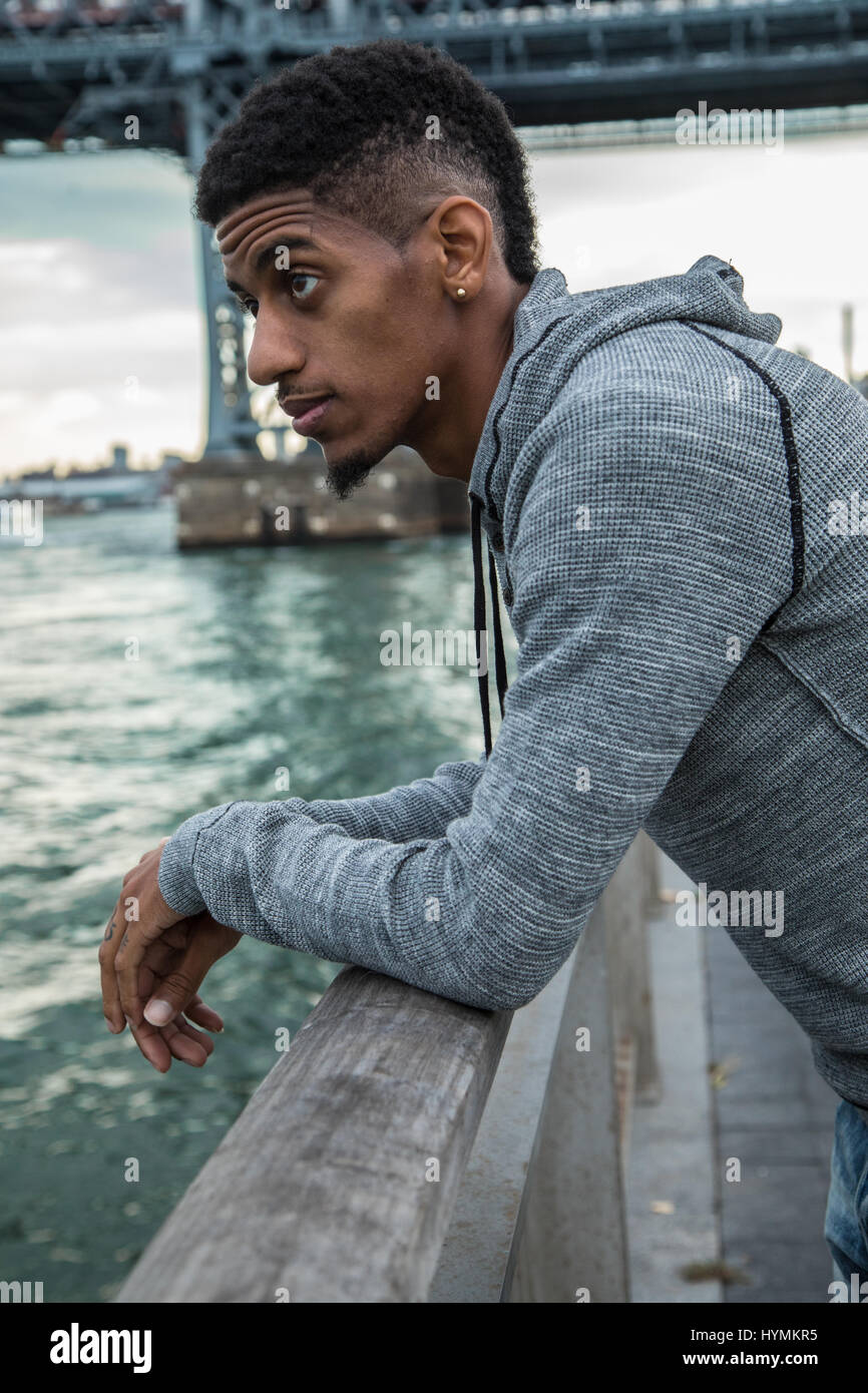 A closeup portrait of a young, black man in New York City. Shot during ...