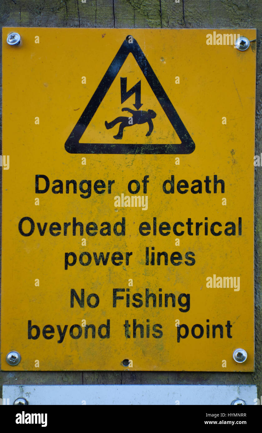 Overhead power line warning sign along canal UK Stock Photo Alamy