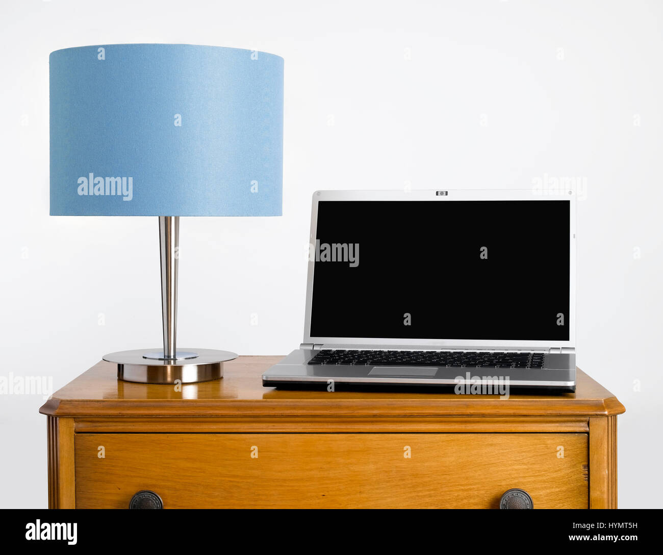 Lampshade on sideboard Stock Photo