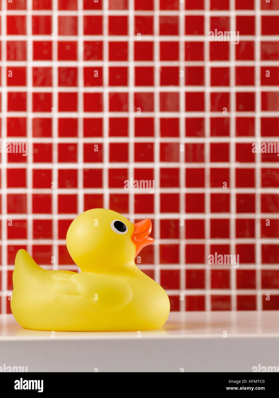 yellow-rubber-duck-on-tiled-background-stock-photo-alamy