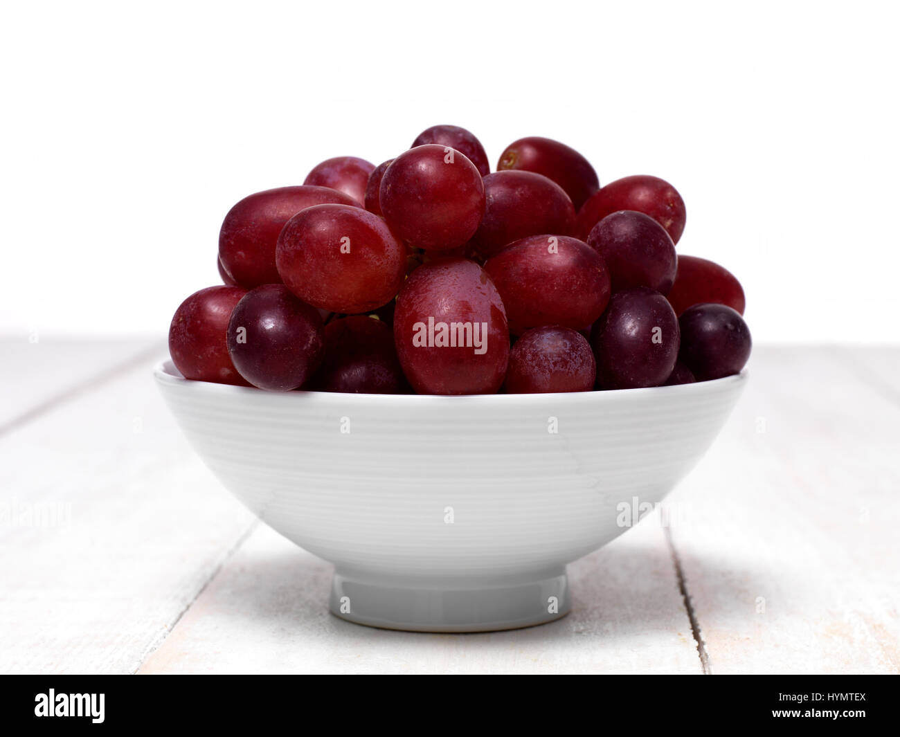 Red Grapes in a small bowl Stock Photo
