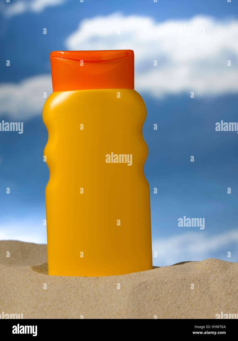 Lotion bottle on a beach Stock Photo