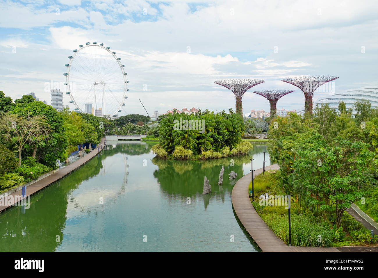 MARINA BAY, SINGAPORE - JAN 20, 2017: Landscape of Gardens by the bay, Supertree grove and Singapore flyer in Singapore. Stock Photo