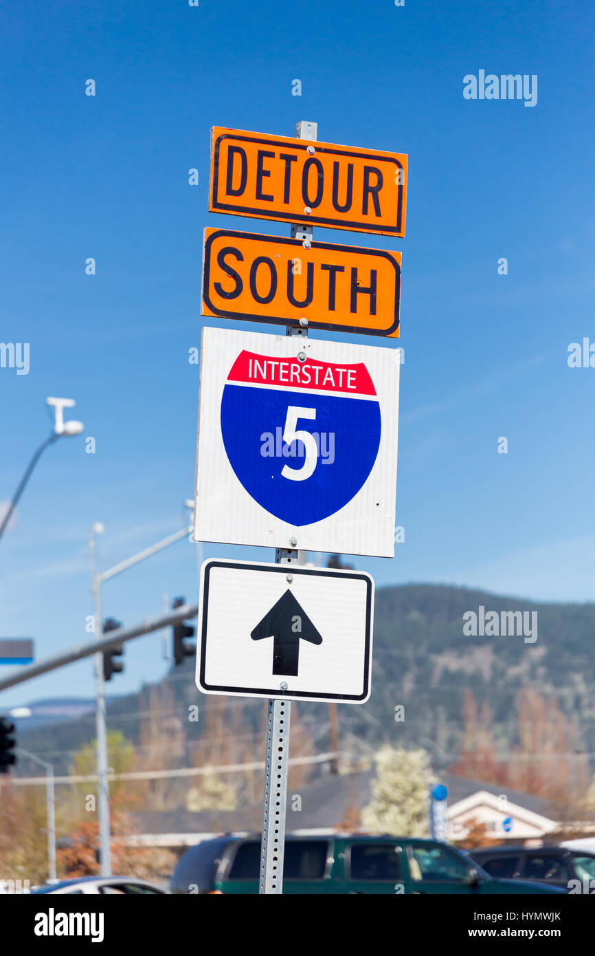 Orange detour sign for Interstate 5 or I5 South detoured through the city to avoid the road construction on the freeway. Stock Photo