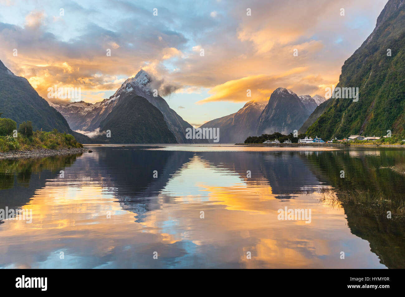 Mitre Peak reflecting in the water, sunset, Milford Sound, Fiordland National Park, Te Anau, Southland Region, Southland Stock Photo