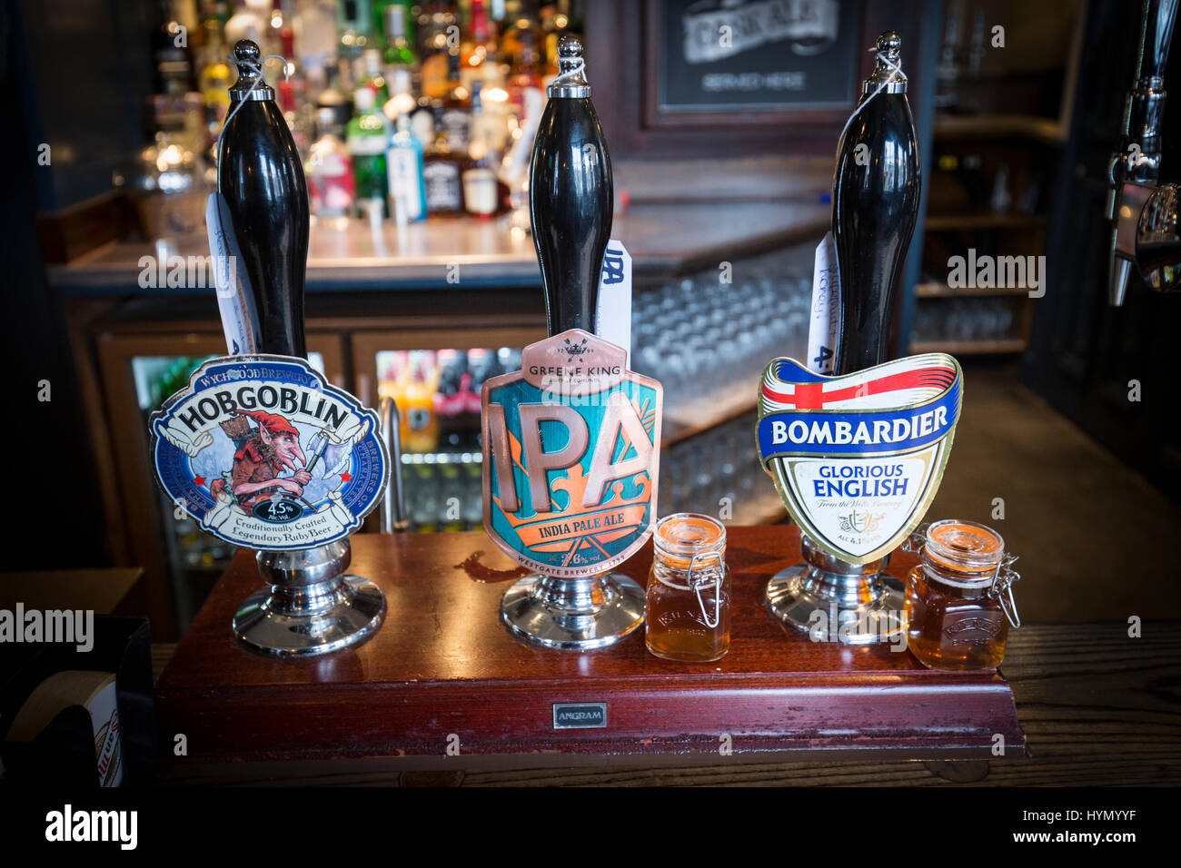 Drink taps in an English pub Stock Photo