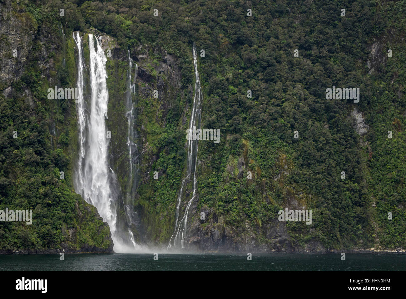 A Waterfall On A Cliff In Milford Sound After Heavy Rain Milford Sound Is A Fiord Part Of Fiordland On New Zealand South Island, Stock Photo