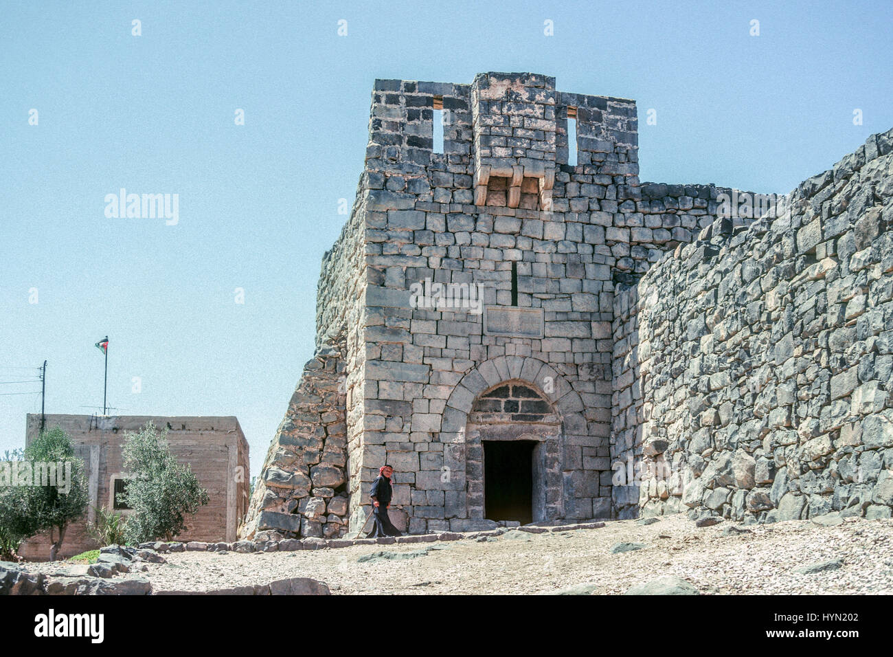 Qasr al-Azraq ('Blue Fortress') is a large fortress located in present-day eastern Jordan. It is one of the desert castles, located on the outskirts of present-day Azraq, roughly 100 km (62 mi) east of Amman. Stock Photo