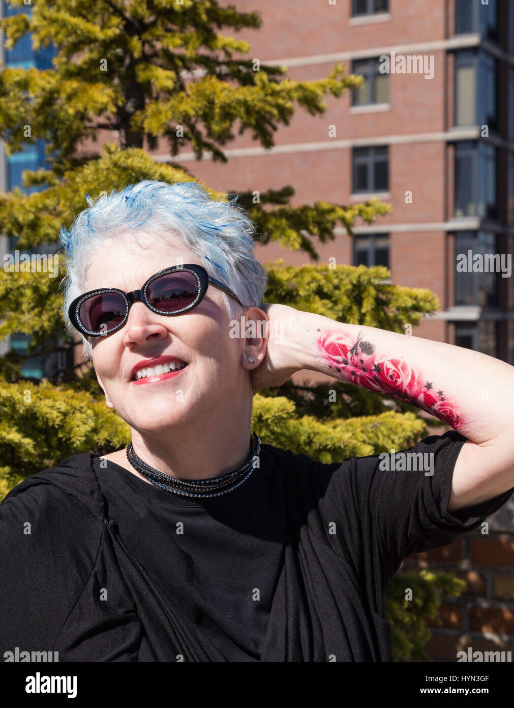 Senior woman tattoos grey hair hi-res stock photography and images - Alamy