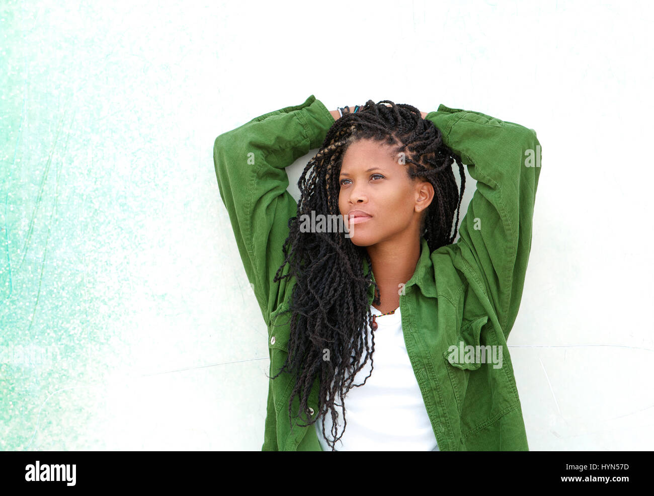 Horizontal close up portrait of a beautiful young black woman relaxing ...