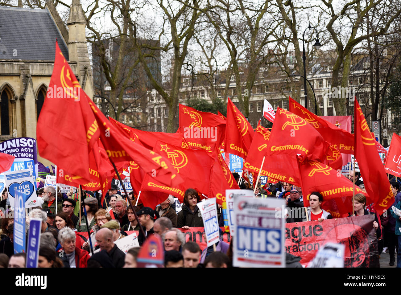 Communist Party flags during the 'Our NHS' support for the National Health Service demonstration on Parliament Stock Photo