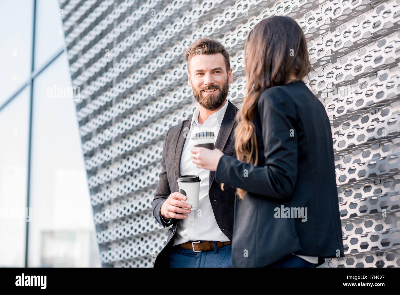 Couple standing outside office hi-res stock photography and images - Alamy