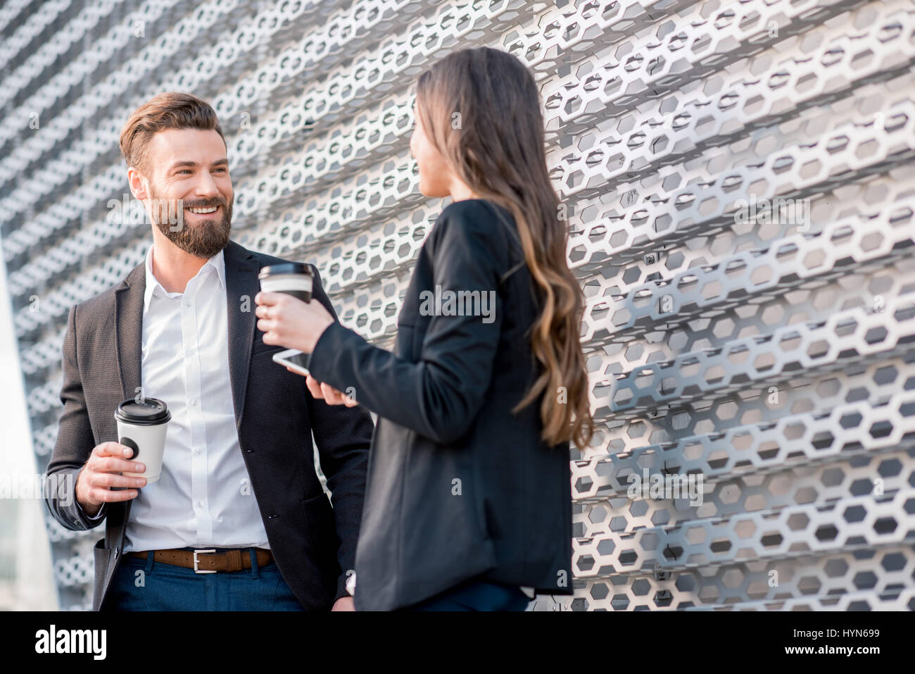 Couple standing outside office hi-res stock photography and images - Alamy