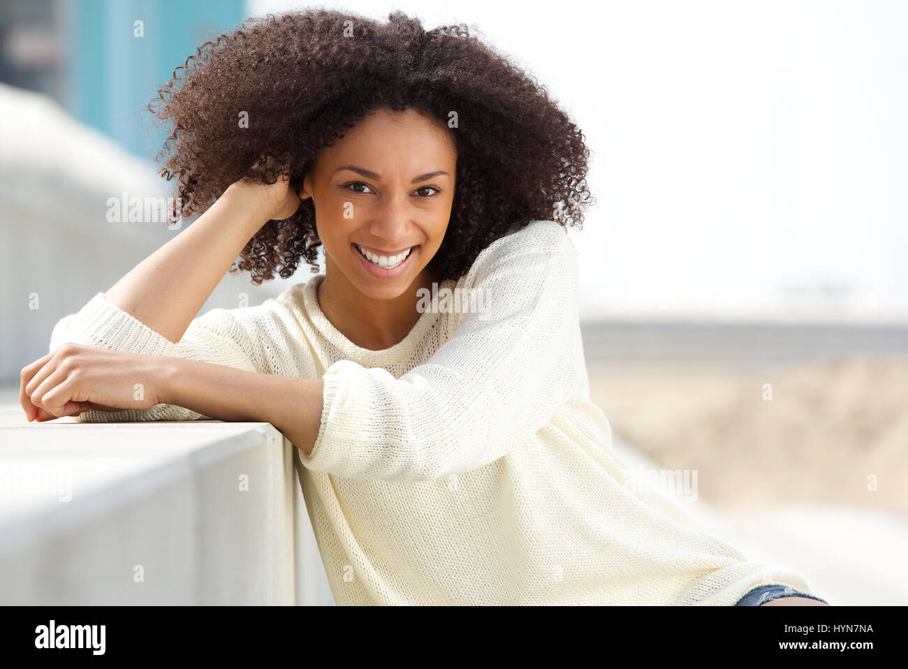 Close up portrait of a smiling african american woman with curly hair ...
