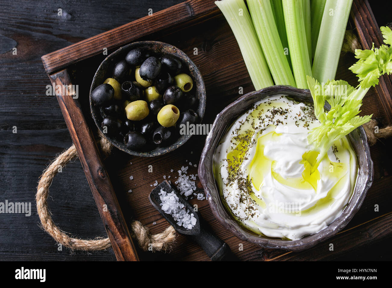 Fresh celery with yogurt dip Stock Photo