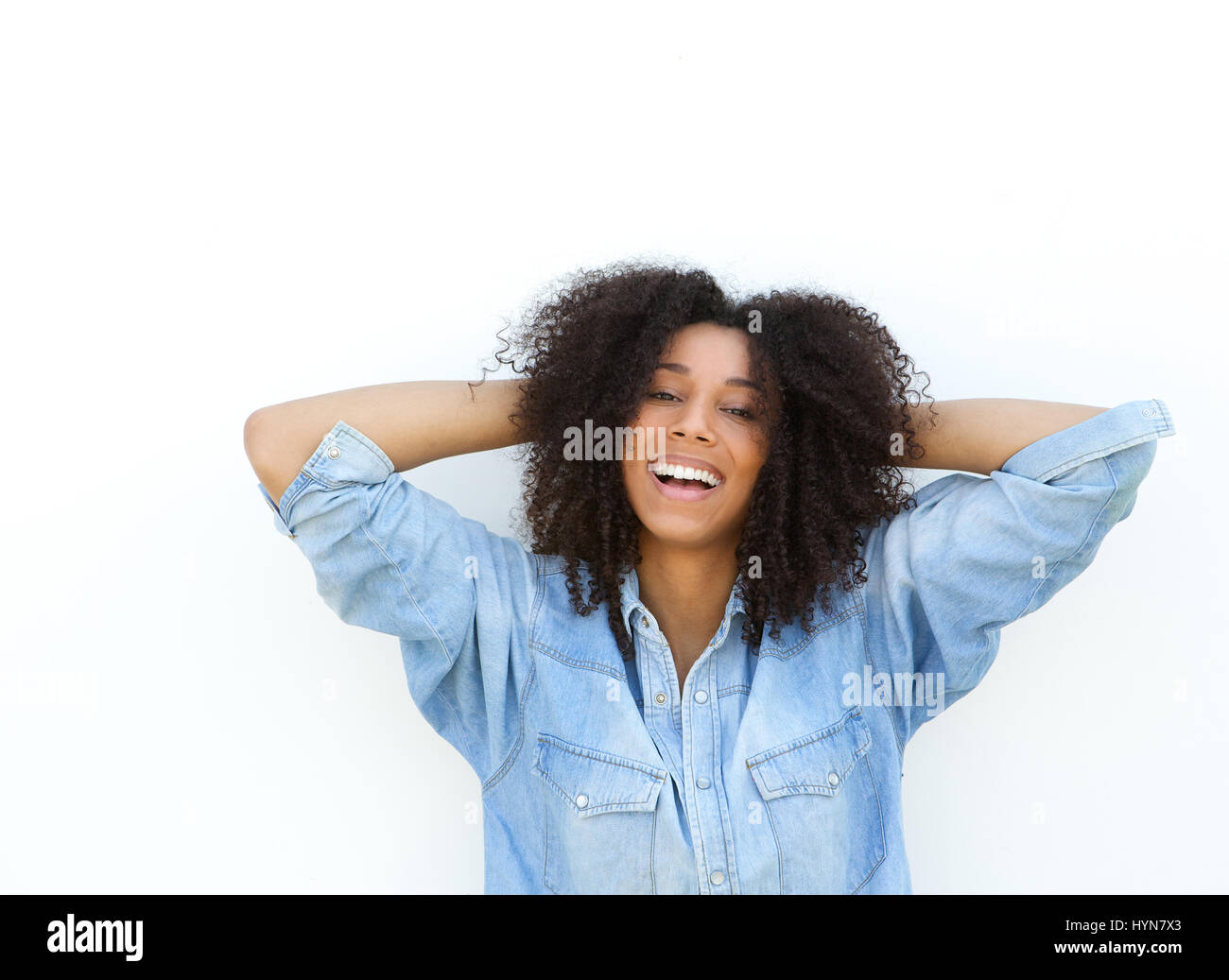 Close up portrait of a smiling african american woman with hands in ...