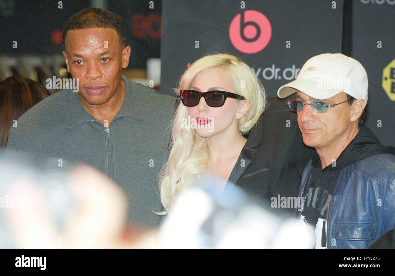 (L-R) Dr. Dre, Lady Gaga and Jimmy Iovine attend Lady Gaga CD release and beats by dr. dre at Best Buy on November 23, 2009 in Los Angeles. Stock Photo