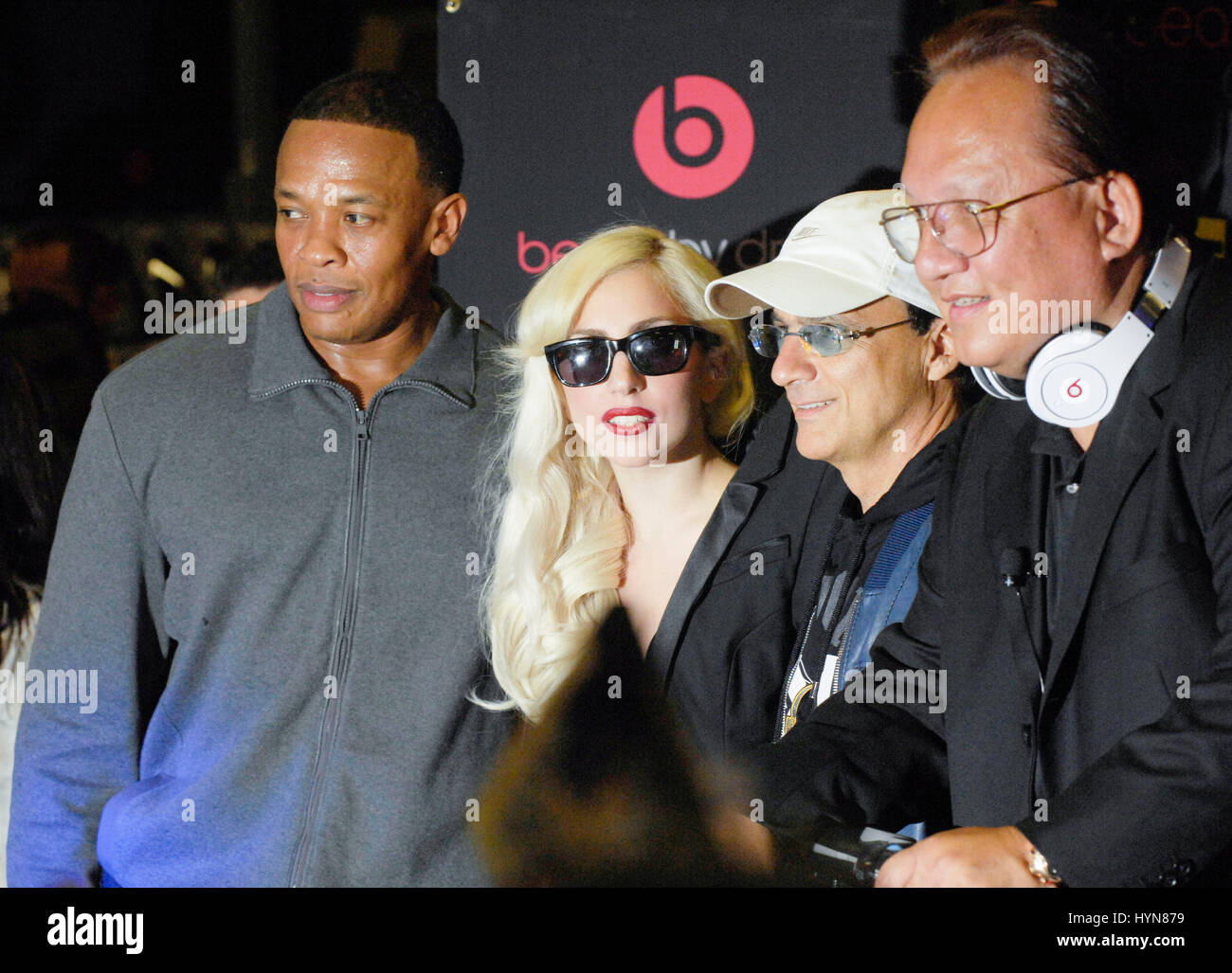 (L-R) Dr. Dre, Lady Gaga and Jimmy Iovine attend Lady Gaga CD release and beats by dr. dre at Best Buy on November 23, 2009 in Los Angeles. Stock Photo