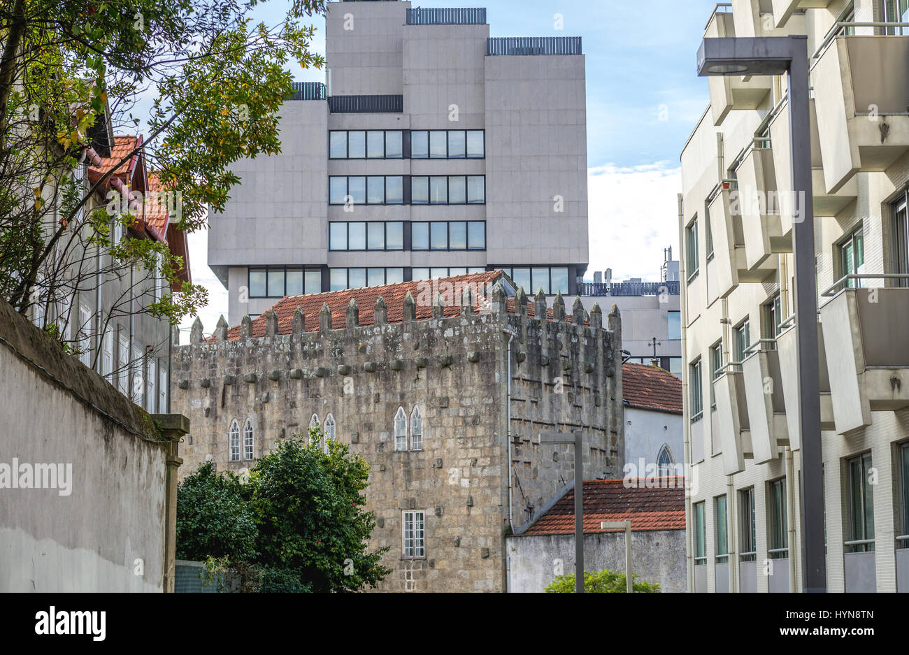 Tower of Pedro-Sem (Residencia da Torre da Marca) former medieval fortification in Porto, Portugal. View with Edificio Tranquilidade office building Stock Photo