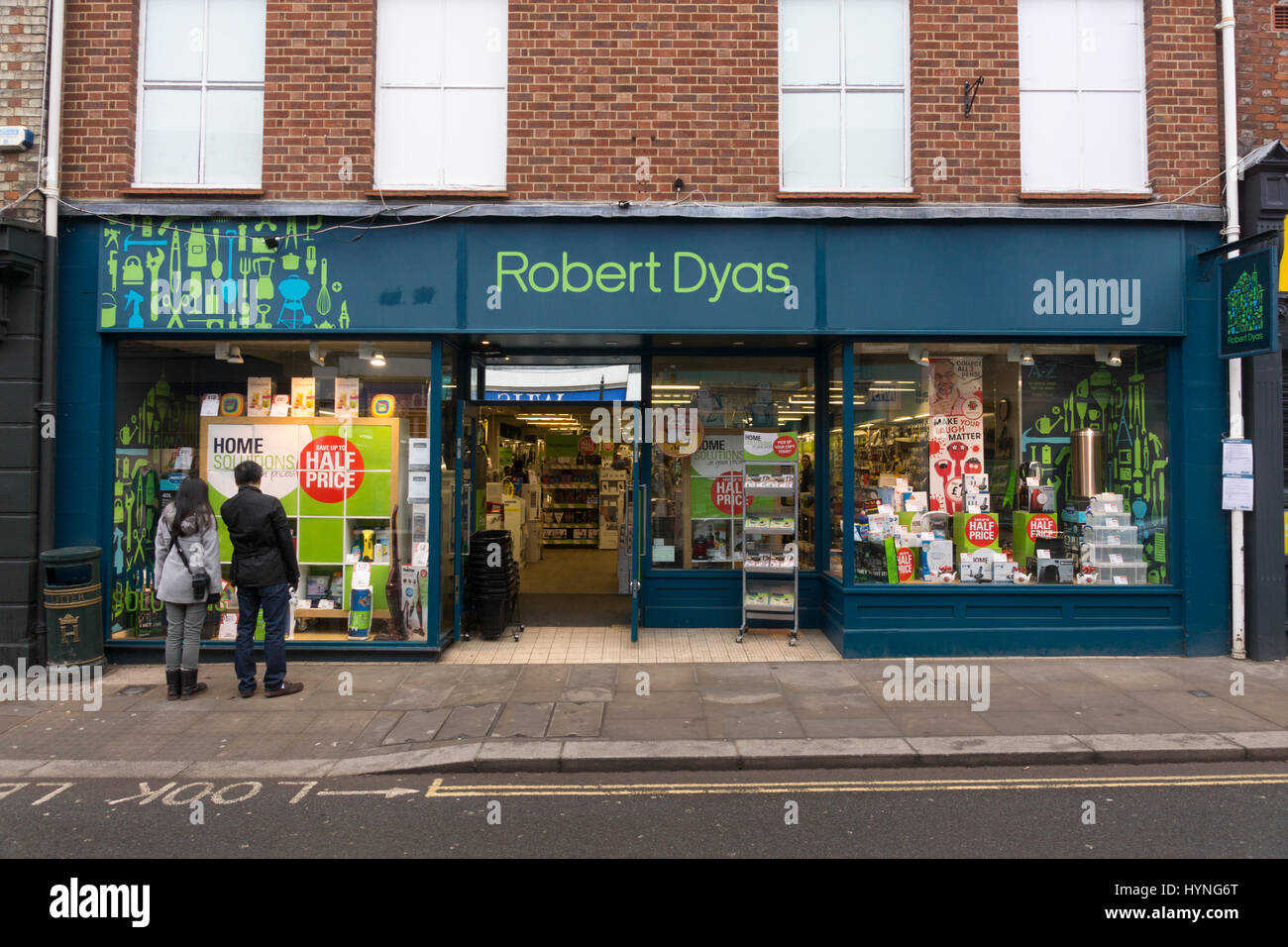 People looking in the window of a Robert Dyas hardware and DIY store in Henley on Thames with half price sales signs on display. England, UK Stock Photo