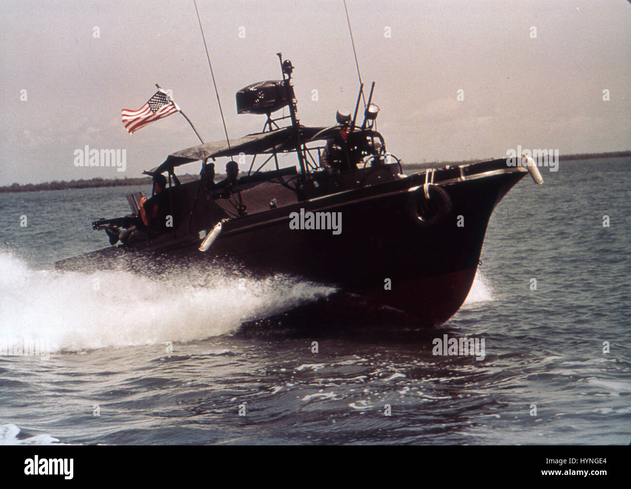 USN River Patrol Boat cruises in an inlet in search of craft carrying supplies to Viet Cong. Vietnam, June 22, 1966. Stock Photo