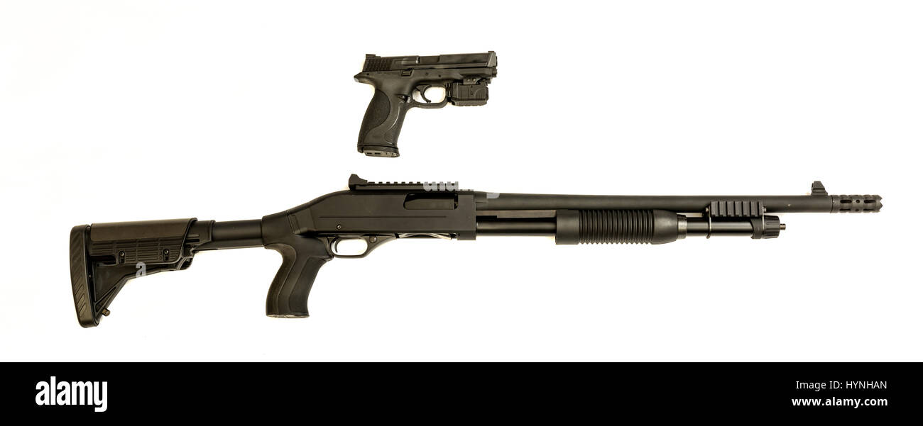 A modern semi auto hand pistol in 9mm and 12 gauge shotgun that is a good combination that swat personal would carry together. Stock Photo