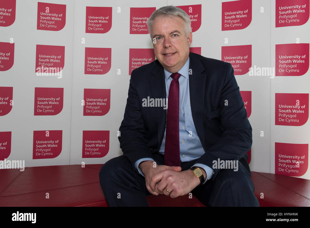 20th March 2017 Newport Campus of USW. Newport. UK .  Carwyn Jones 46 First Minster of Wales. Mr Jones sits behind banners of USW  he comes to the New Stock Photo