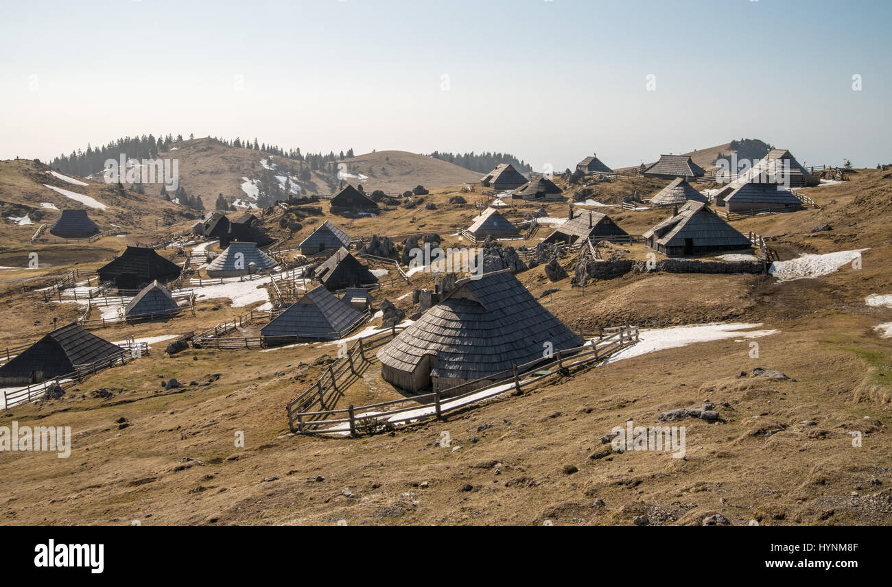 Scenic high alpine pasture Velika Planina and old traditional wooden shepherd cottages in Slovenia Stock Photo