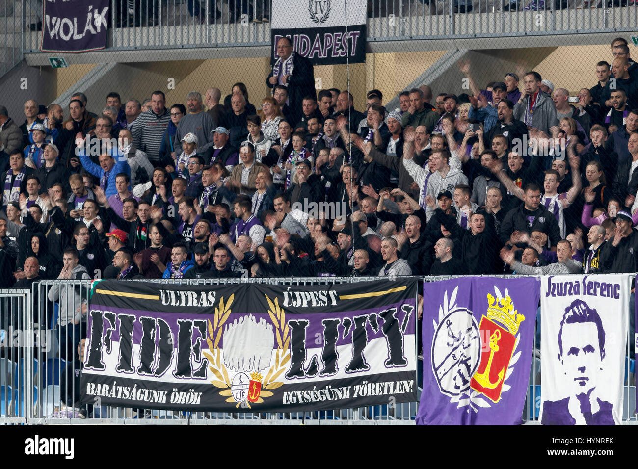 Budapest, Hungary. 05th Apr, 2017. Ultras of Ujpest FC encourage their team during the Hungarian Cup Round of 8 second leg match between Vasas FC and Ujpest FC at Nandor Hidegkuti Stadium on April 5, 2017 in Budapest, Hungary. Credit: Laszlo Szirtesi/Alamy Live News Stock Photo