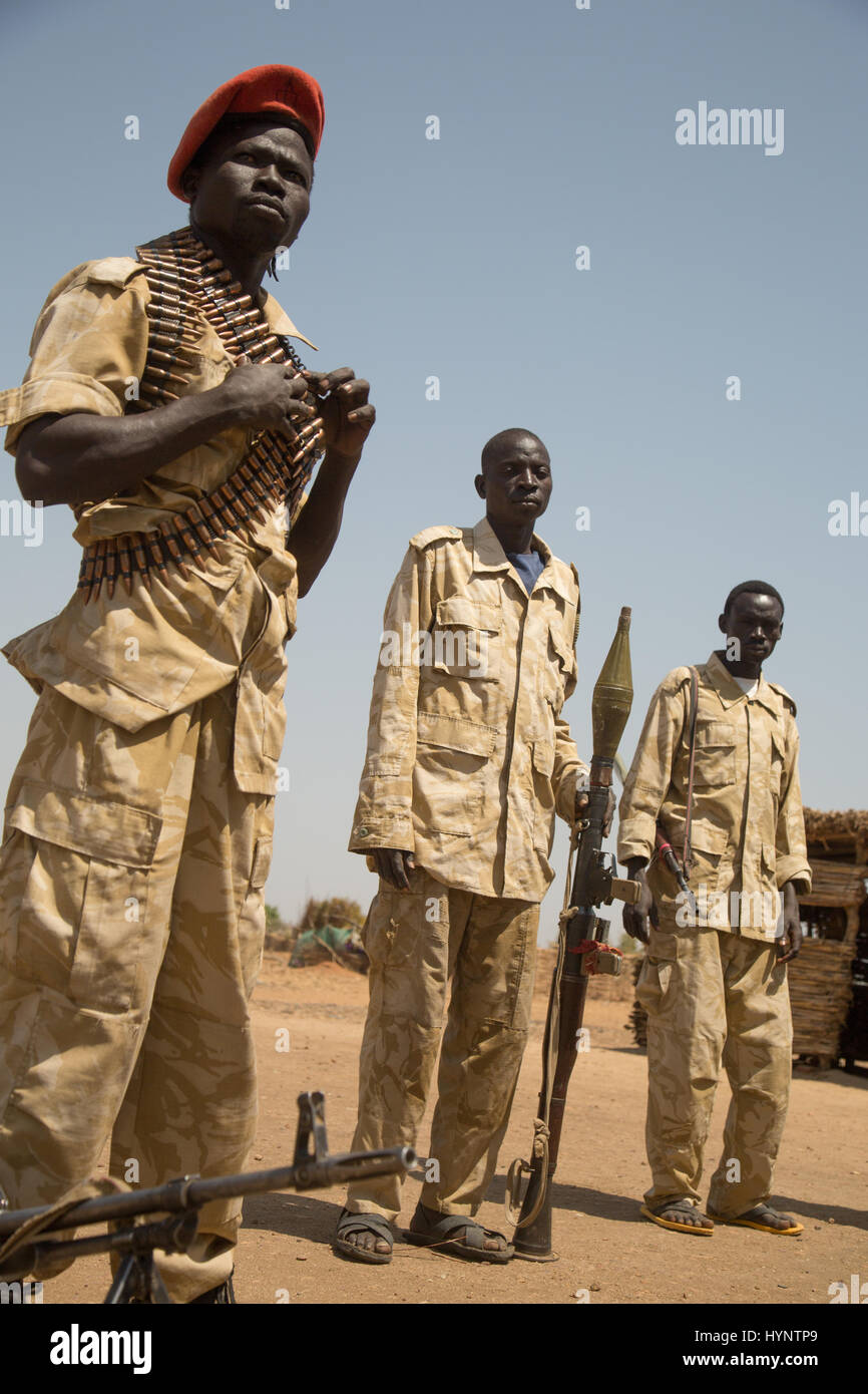 Heiban, Sudan. 12th Feb, 2017. Fighters of the General Hamza brigade stand in full gear on a plaza in Heiban, Sudan, 12 February 2017. Weapons and ammunition of the SPLA-N are acquired through raids of the government troops. The Nuba mountains are held by the Sudanese Liberation Army and their political branch (SPLM-N). Photo: Laura Wagenknecht/dpa/Alamy Live News Stock Photo