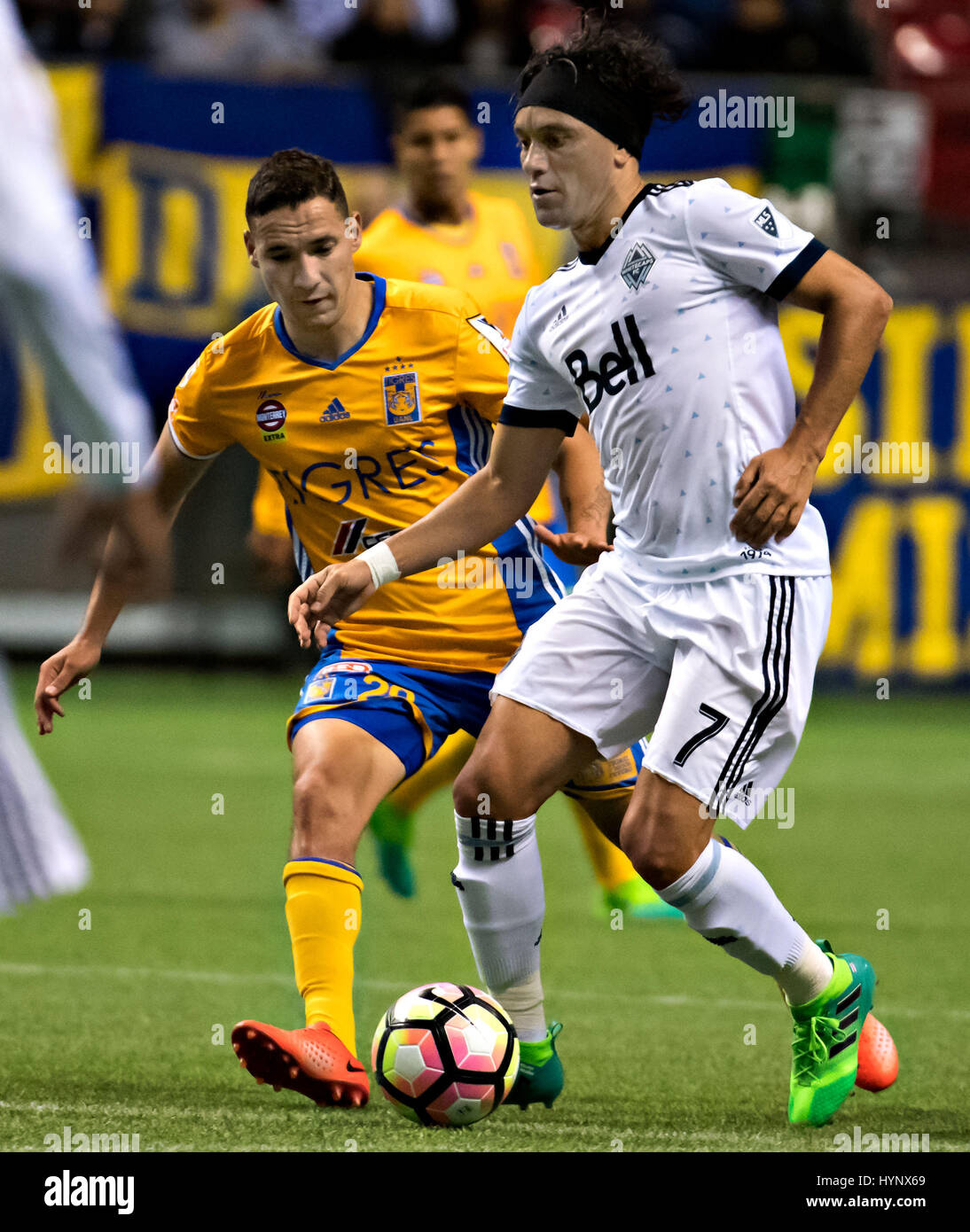 (170406) -- VANCOUVER, April, 6, 2017 (Xinhua) -- Jesus Duenas Manzo(L) of Mexico's Tigres UANL vies with Christian Bolanos Navarro of Major League Soccer's Canadian Vancouver Whitecaps during the second-leg match of the CONCACAF Champions League 2016/2017 Semifinal in Vancouver, Canada, April 5, 2017. Tigres UANL won 2-1 and advanced to the final with 4-1 on aggregate. (Xinhua/Andrew Soong) Stock Photo