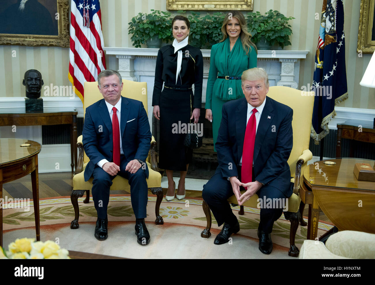 United States President Donald J. Trump meets King Abdullah II of Jordan in the Oval Office of the White House in Washington, DC on Wednesday, April 5, 2017. Standing behind the King and President are Queen Rania of Jordan, left, and first lady Melania Trump. Credit: Ron Sachs/Pool via CNP - NO WIRE SERVICE - Photo: Ron Sachs/Consolidated News Photos/Ron Sachs - Pool via CNP Stock Photo