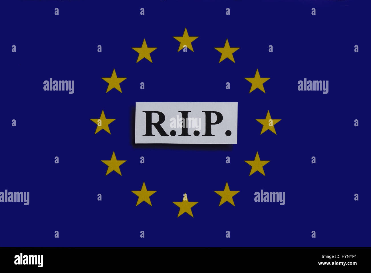 ILLUSTRATION - The abbreviation "R.I.P" (Latin: Requiescat in pace/ "Rest in Peace") stands on top of a European Union flag. Taken on 02.01.2017. "Rest in Peace" in a frequently used grave inscription. The possibility of the breakdown of the European integration project hangs in the air. The crash of the European single currency is no longer only a whisper. The neoliberal EU divides Europe - socially, culturally and nationally. If selfishness, a free-riding mentality, block-building and unwillingness to reform national economies within the EU continue to dominate, there will be only one result Stock Photo