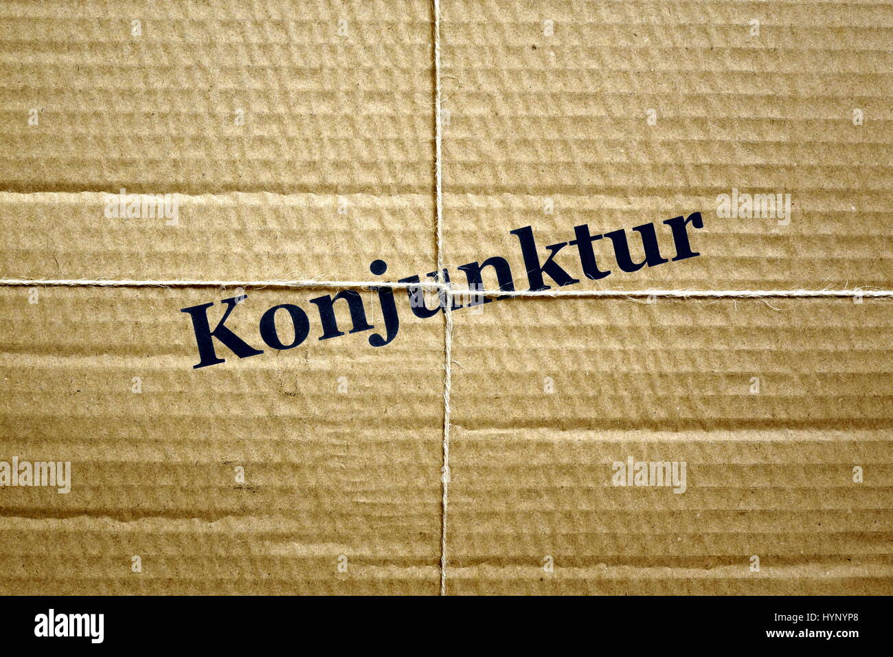Berlin, Germany. 30th May, 2016. ILLUSTRATION - Image of a bound up package with the word 'Konjunktur' (economic situation), taken on 30.05.2016. The phrase 'Konjunkturpaket' is the short name for two German government economic stimuli packages. Economic packages I and II for the years 2009 and 2010 were worth around 80 billion euros. 40 million of that was set aside for public infrastructure, whilst another 27 billion was used to reduce the tax burden in the long term. - NO WIRE SERVICE - Photo: Sascha Steinach/dpa-Zentralbild/dpa | usage worldwide/dpa/Alamy Live News Stock Photo