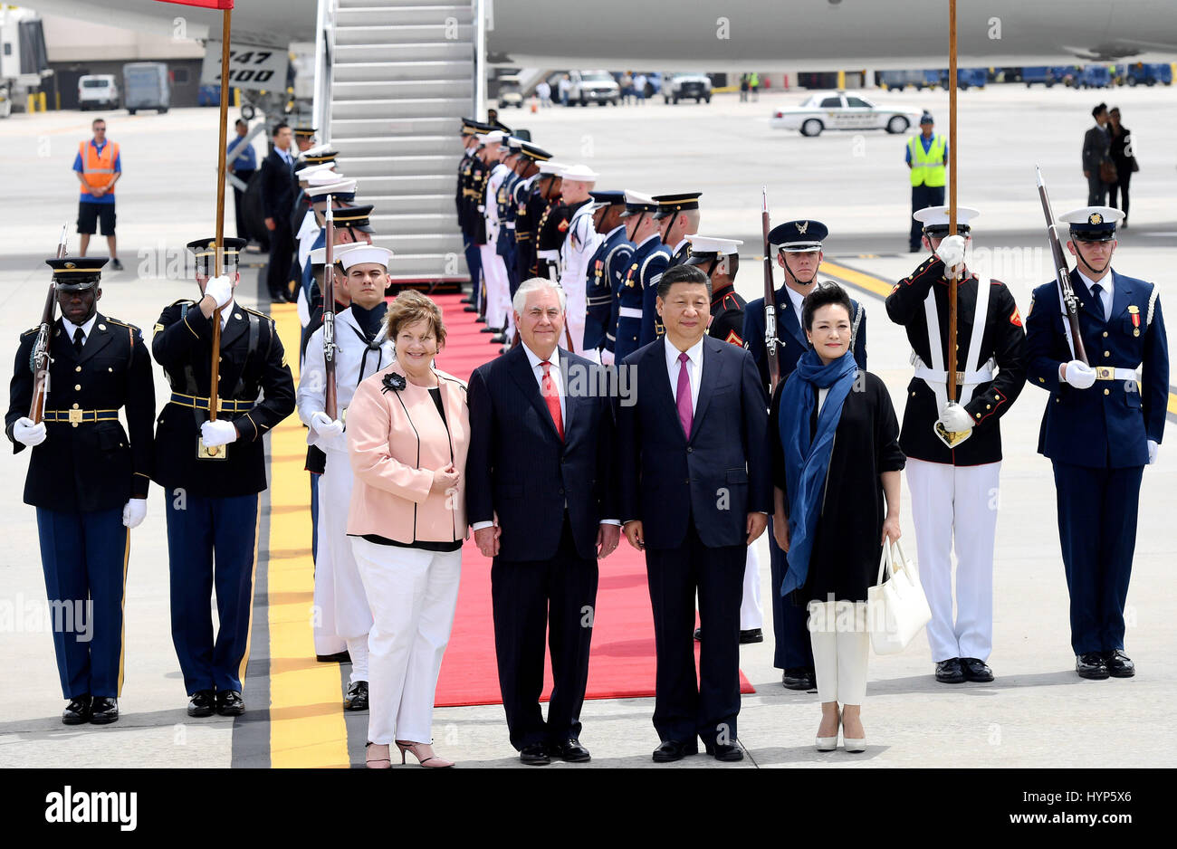 Palm Beach, USA. 6th Apr, 2017. Chinese President Xi Jinping (2nd R, front) and his wife Peng Liyuan (1st R, front) are welcomed by U.S. Secretary of State Rex Tillerson (2nd L, front) and his wife upon their arrival at Palm Beach International Airport in Florida, the United States, April 6, 2017. Xi arrived here for the first meeting with U.S. President Donald Trump. Credit: Wu Xiaoling/Xinhua/Alamy Live News Stock Photo