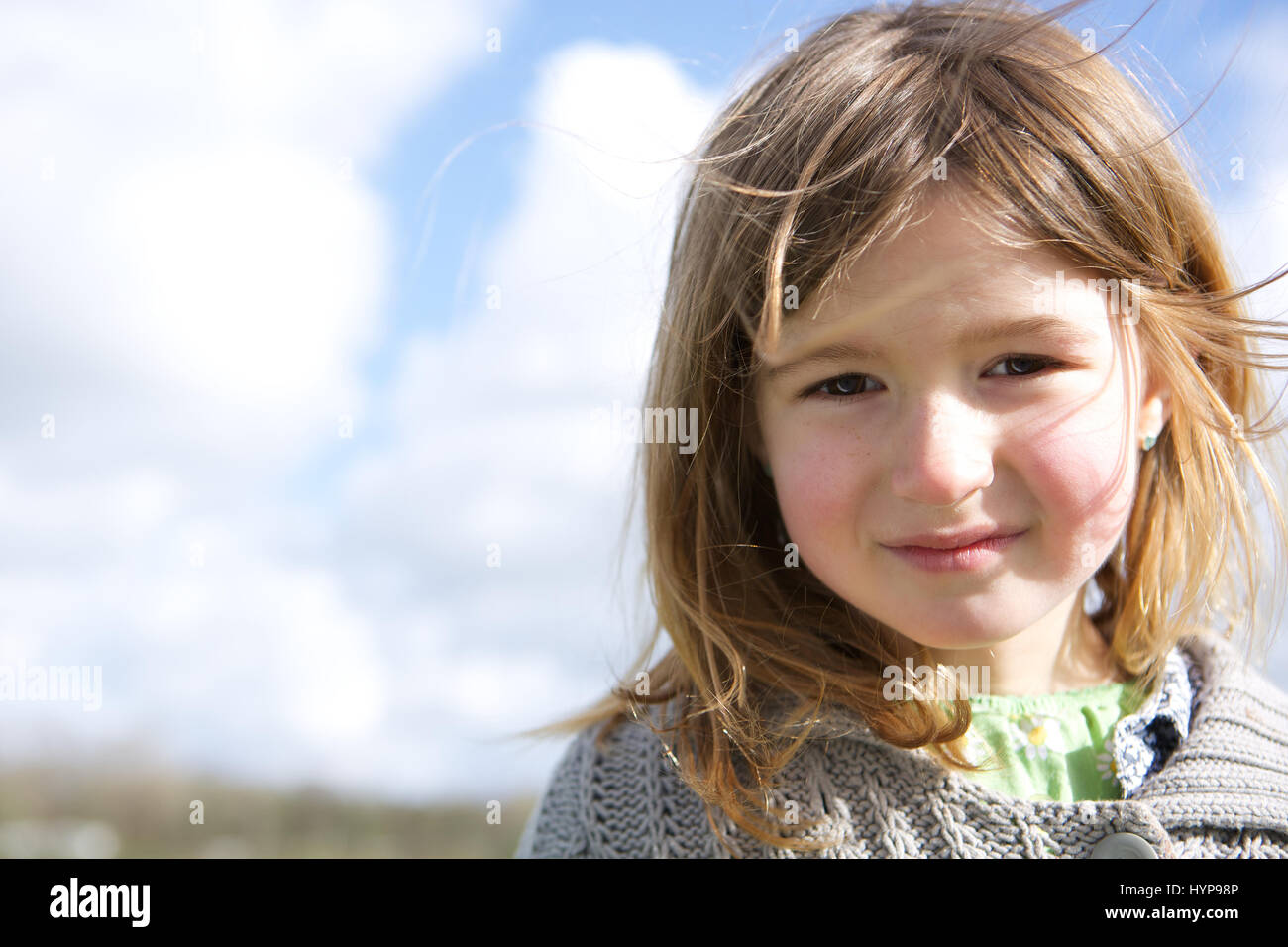 Close up portrait of a cute girl smiling outdoors Stock Photo - Alamy