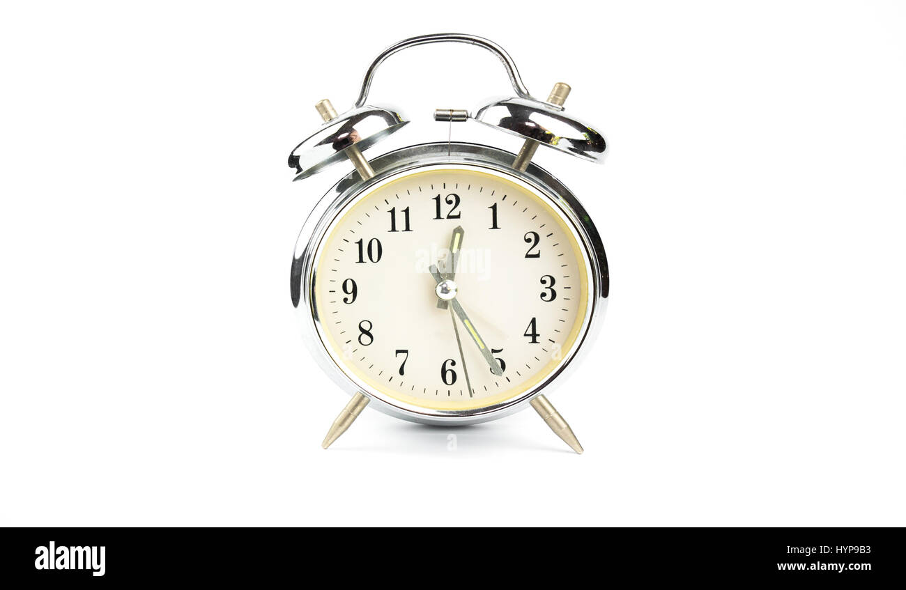 Retro table clock on white background Stock Photo - Alamy