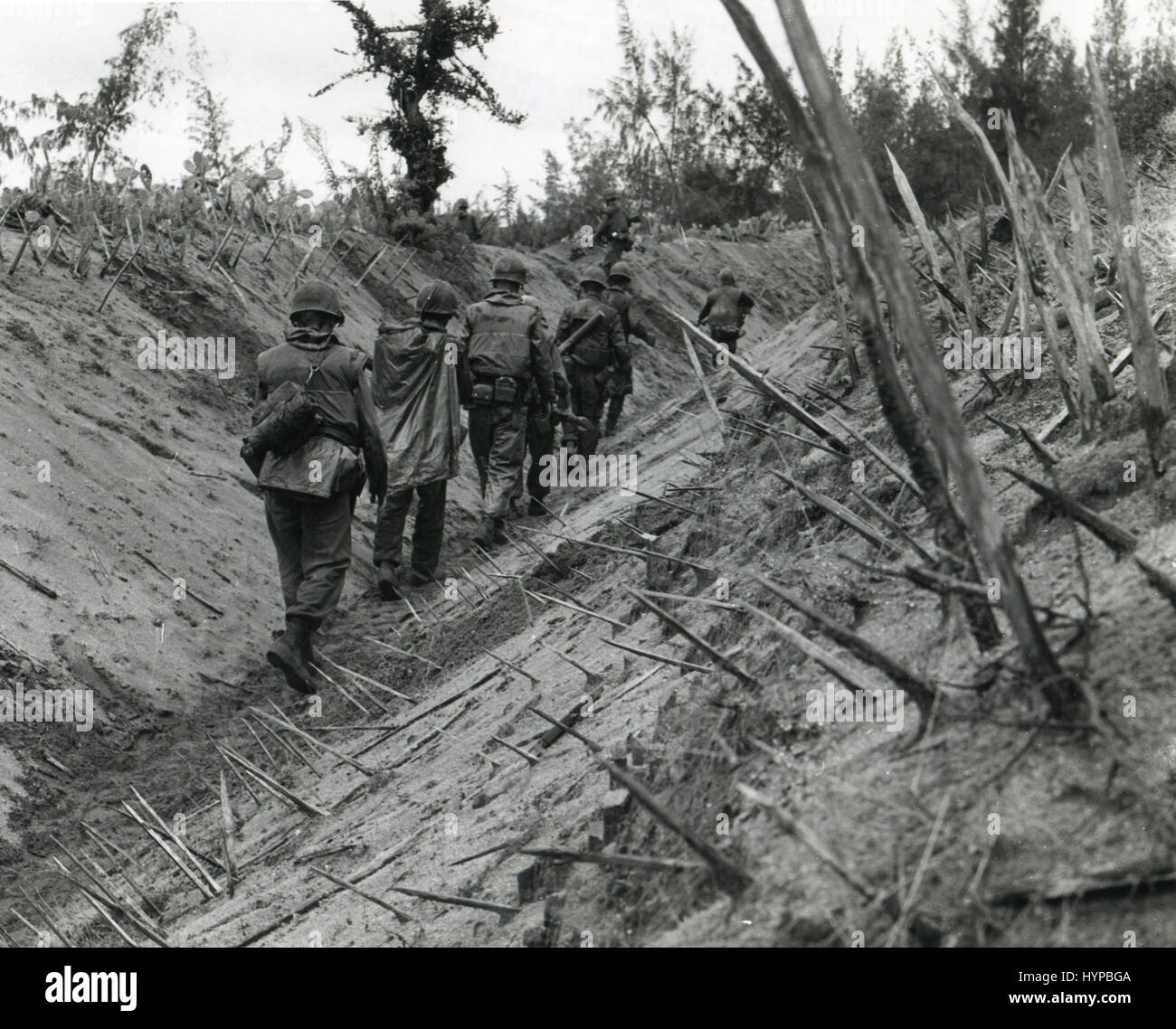 Punji-staked gully provides rough going for Marines of 'F' Company, 2d battalion, 4th Regt during OPERATION DOUBLE EAGLE, Vietnam, January, 1966. Stock Photo