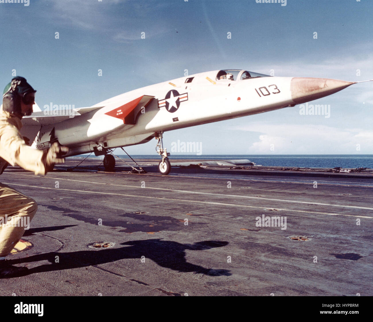 1966 - Catapult officer on board USS ENTERPRISE (CVAN-65) gives the GO signal for the launch of a VIgilante reconnaissance aircraft. This aircraft will bring back information vital to the planning of raids against North Vietnam. Stock Photo