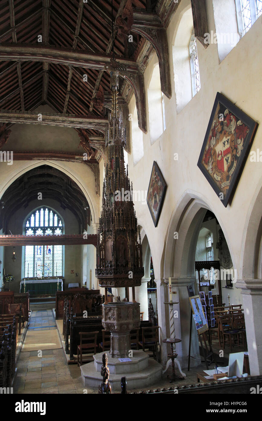 Ornately decorated large wooden baptismal font cover Ufford church