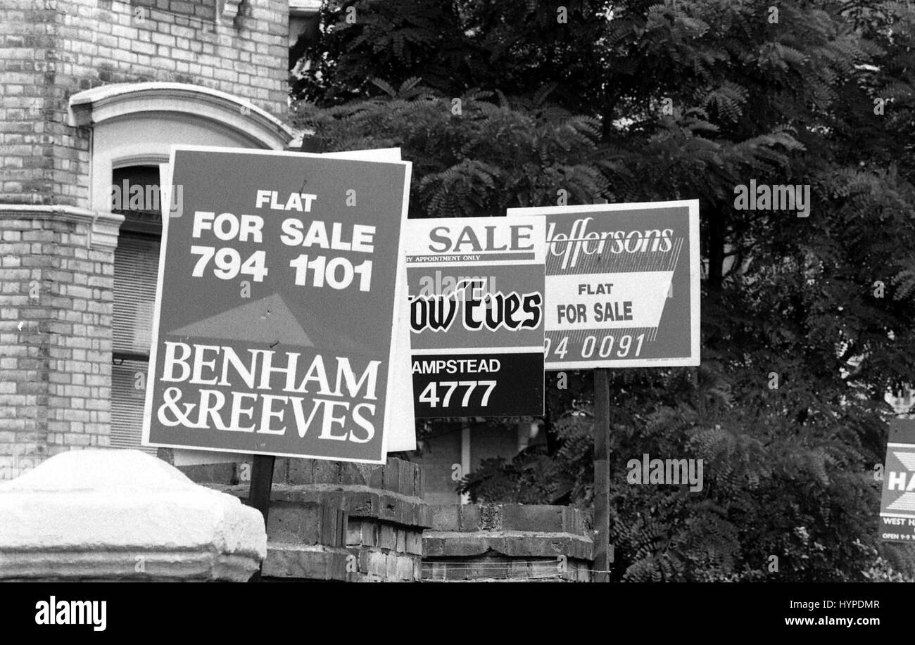 Estate Agents property for sale boards at West Hampstead in London