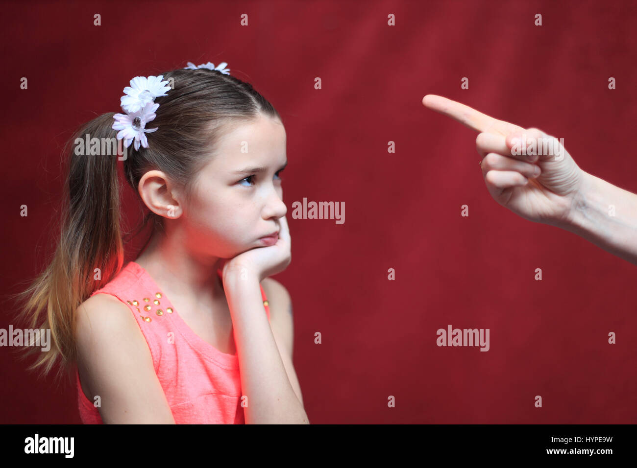 France, 10 years old girl facing parental authority Stock Photo